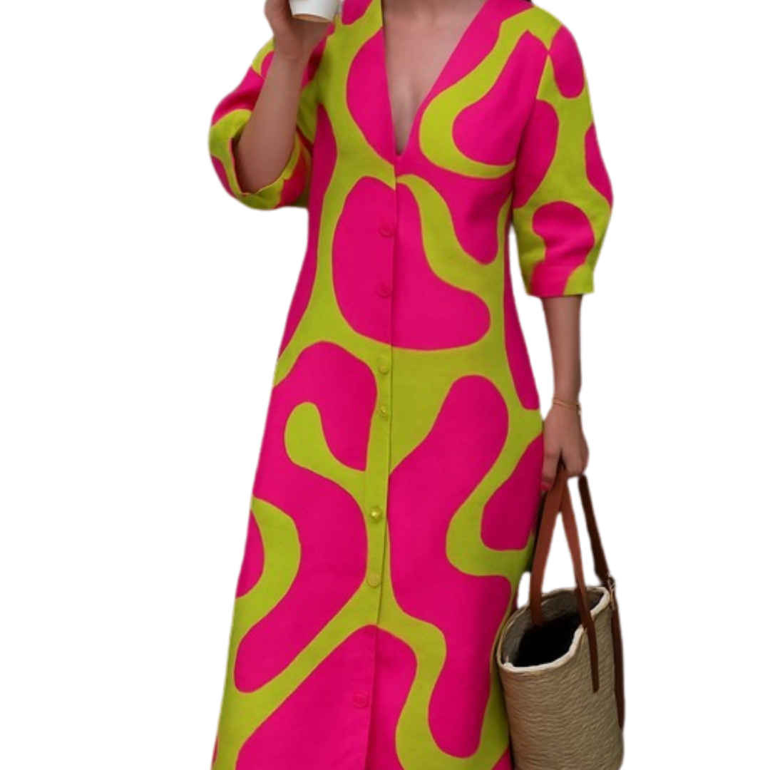 Woman wearing vibrant pink and green Neon Noir Dress holding coffee cup and straw tote bag with sunglasses.