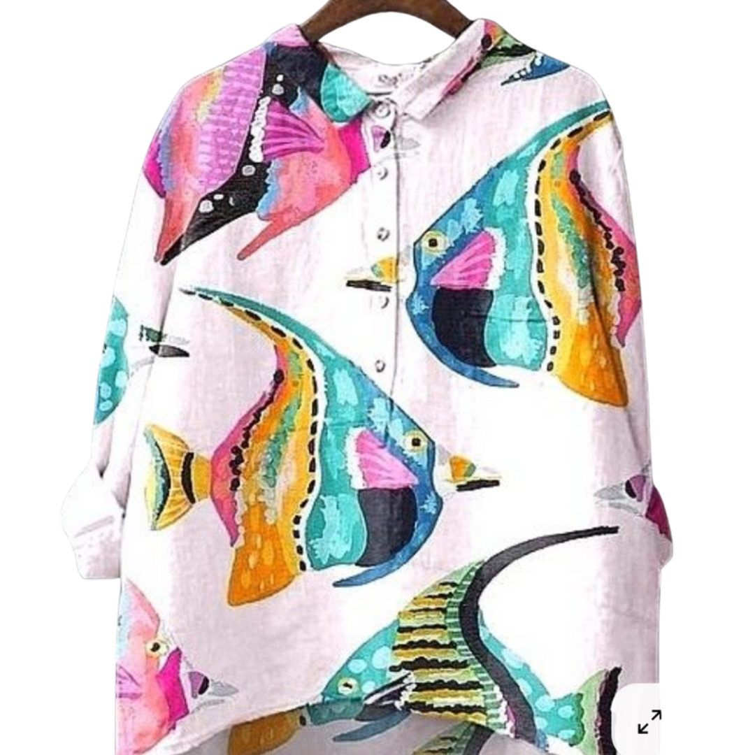 Sea No Evil Shirt oversized with bold tropical fish in bright colors on a pink ocean background.