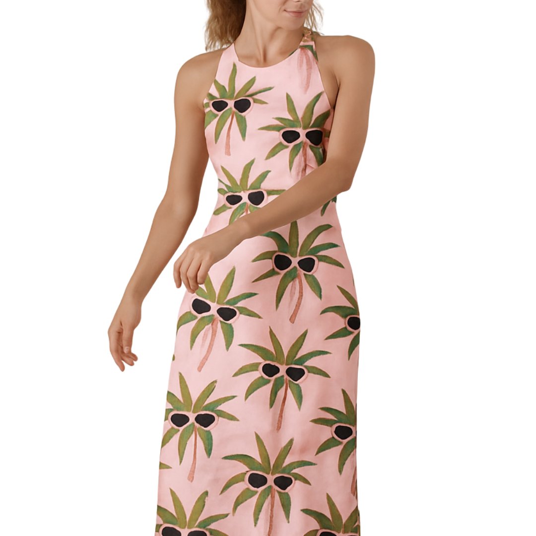 Woman wearing pink halter maxi dress with black shade palm tree print Tropicool Maxi
