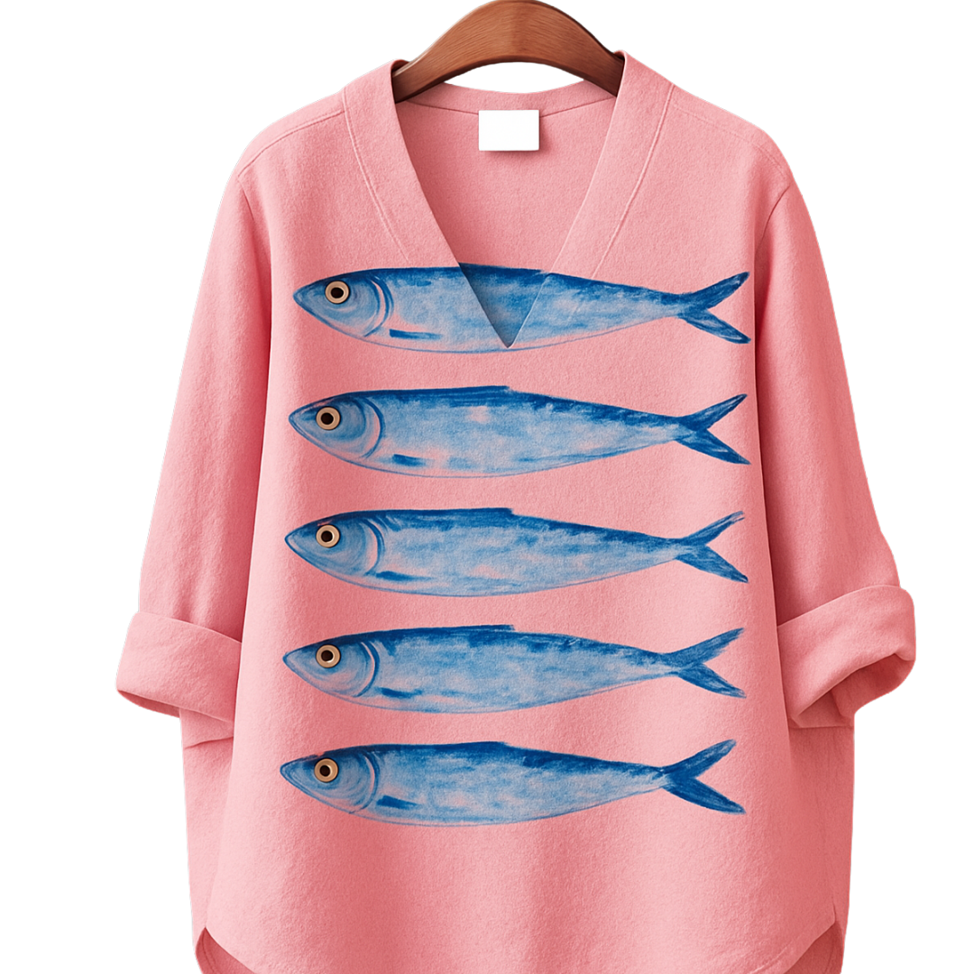 What The Fish Shirt in pink with five blue fish illustrations, perfect for standing out and swimming against the current.