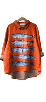 Bright Side of Fish Shirt oversized orange shirt with blue fish design, one fish swimming opposite the rest.