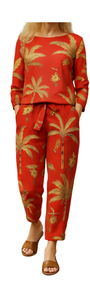 Co-ord of the Wild rust-hued set with golden palm prints, featuring a long-sleeve top and matching tie-waist pants.