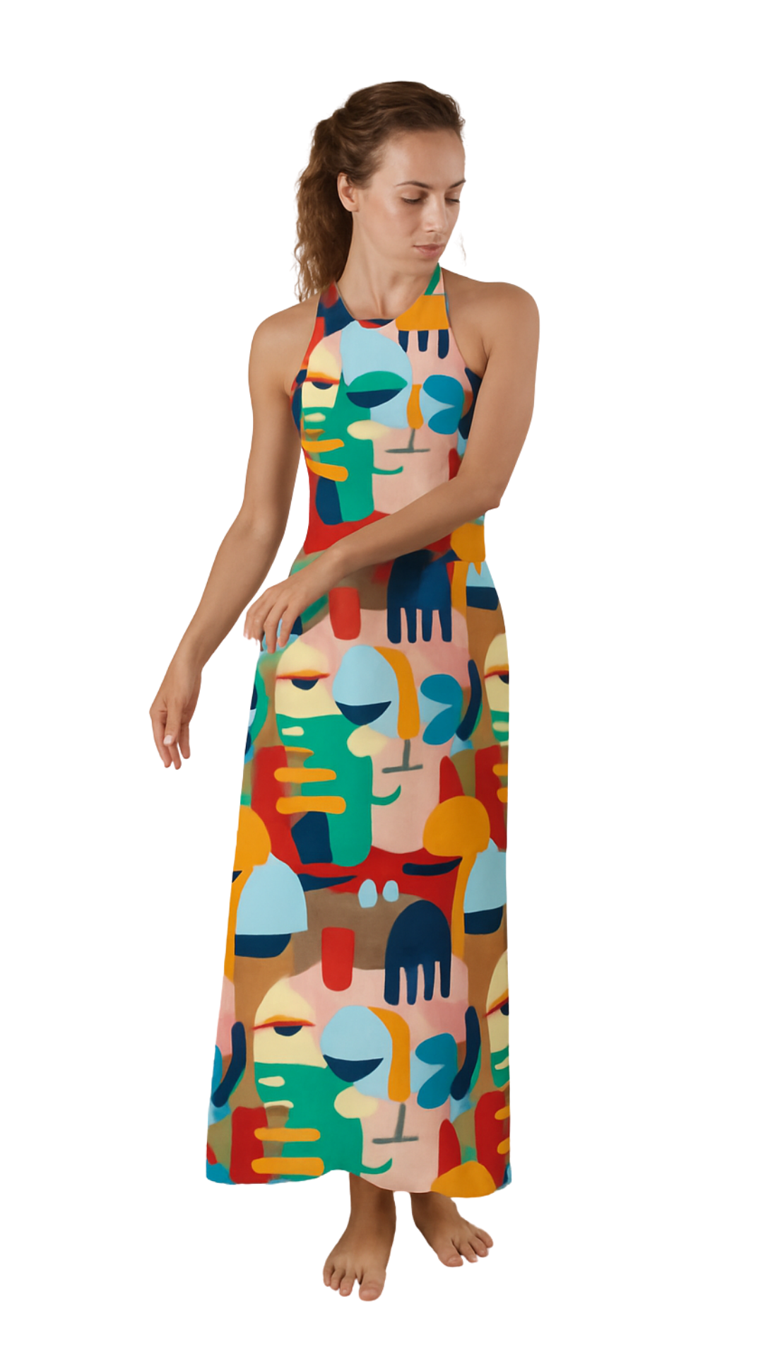 Woman wearing a Colour Rush dress featuring bold abstract faces and vibrant high-contrast hues in a halter-neck maxi style.