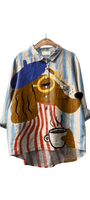 Dog Days & Lattés Shirt featuring a dog in a beret with bold stripes holding a steaming cup on a linen oversized shirt.
