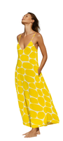 Woman wearing a yellow pebbled print flowy dress with thin straps, titled Hello Yello Maxi, posing with eyes closed.