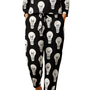 Woman wearing Lit Up Co-ord Set with black fabric covered in white hand-drawn light bulb motifs, paired with brown sandals.