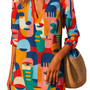 Paint me bold Dress with colorful surreal face prints, knee-length relaxed fit perfect for making a bold statement.