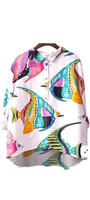 Sea No Evil Shirt oversized with bold tropical fish in bright colors on a pink ocean background.